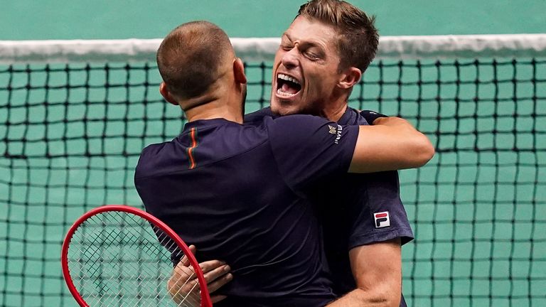 Dan Evans and Neal Skupski (R) celebrate Davis Cup doubles victory over Switzerland