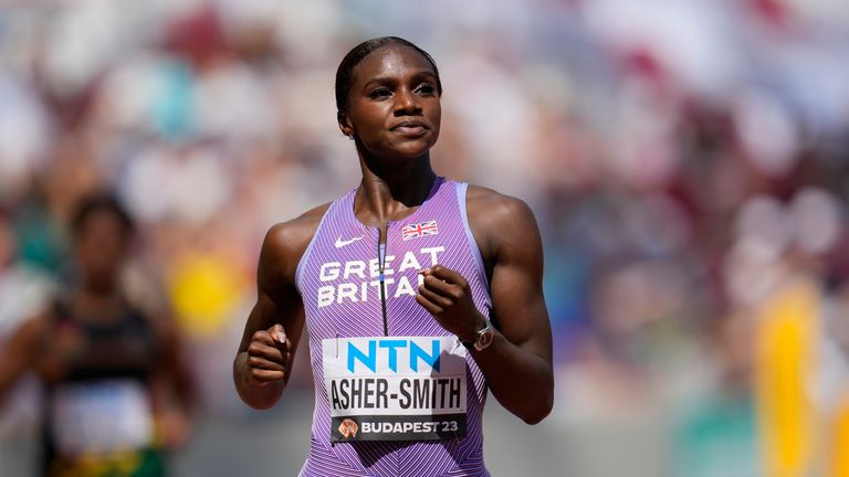 Dina Asher-Smith, of Great Britain, reacts after finishing the Women's 100-meters heat during the World Athletics Championships in Budapest, Hungary