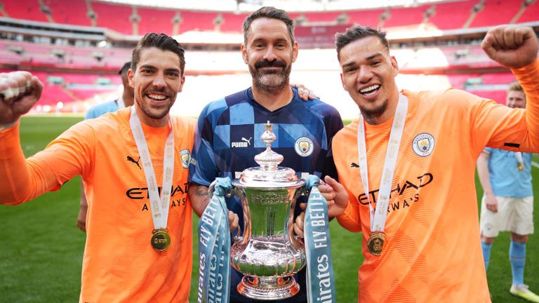 Ederson poses with Stefan Ortega and Scott Carson