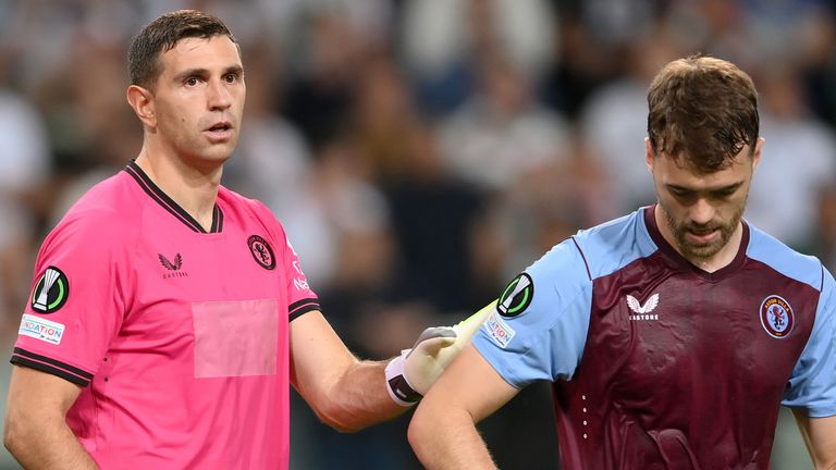 Aston Villa goalkeeper Emiliano Martinez (left) and teammate Calum Chambers looked dejected during their defeat at Legia Warsaw