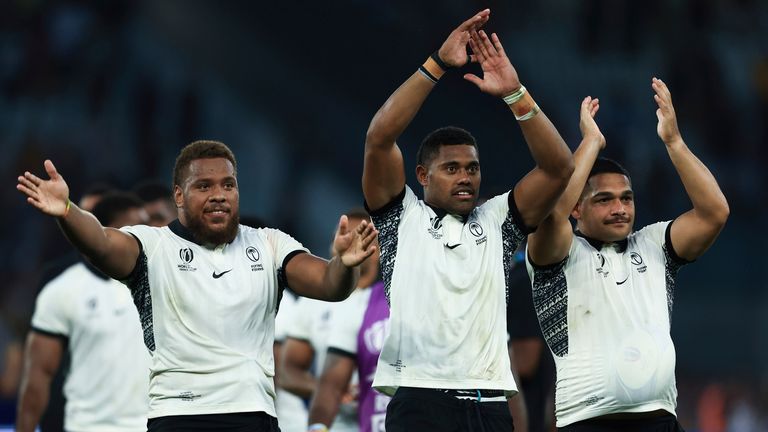 Fiji's players celebrate after the Rugby World Cup Pool C match between Australia and Fiji at the Stade Geoffroy Guichard in Saint-Etienne, France, Sunday, Sept. 17, 2023. (AP Photo/Aurelien Morissard)