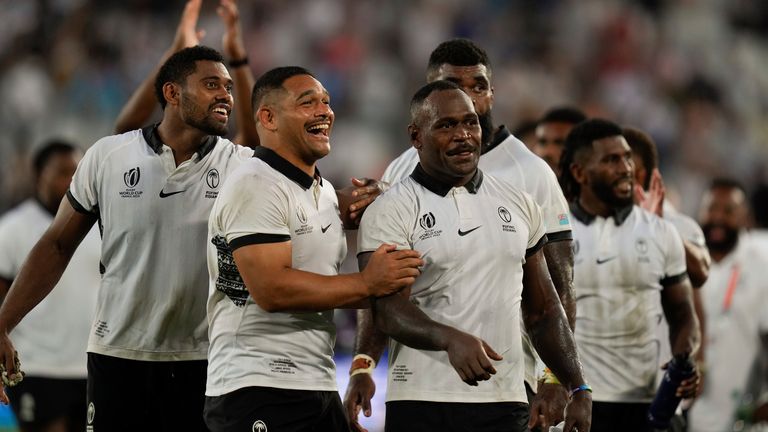 Fiji's Levani Botia, center right, celebrates with teammates after beating Georgia to edge closer to Rugby World Cup quarter-finals