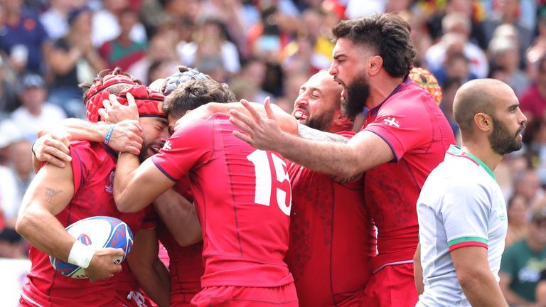 Akaki Tabutsadze of Georgia (L) reacts after scoring a try against Portugal (AP Images )
