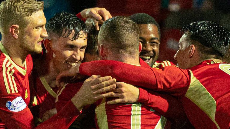 DINGWALL, SCOTLAND - SEPTEMBER 27: Aberdeen players celebrate after Graeme Shinnie scores to make it 1-0 during a Viaplay Cup Quarter-final match between Ross County and Aberdeen at the Global Energy Stadium, on  September 27, 2023, in Dingwall, Scotland. (Photo by Ross Parker / SNS Group)