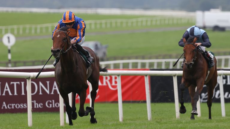 Henry Longfellow pulls clear to win the National Stakes for Aidan O'Brien