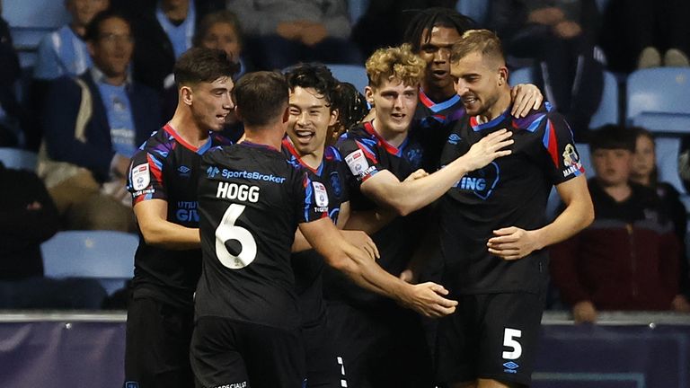 Huddersfield Town&#39;s Michal Helik (right) celebrates with team-mates after scoring their side&#39;s first goal