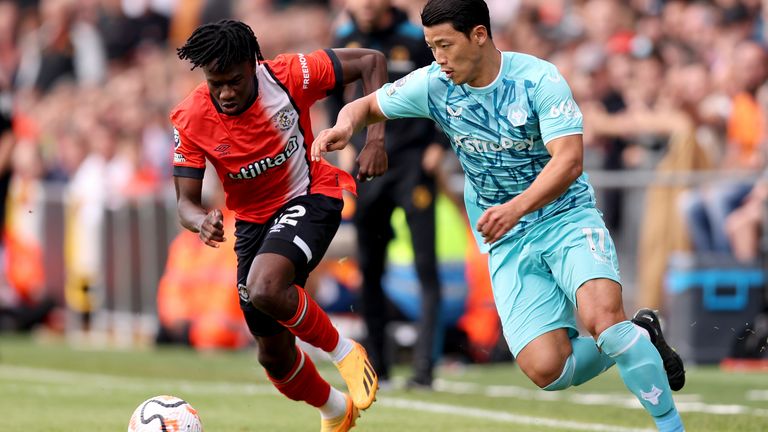 Issa Kabore of Luton Town battles for possession with Hee-Chan Hwang of Wolves