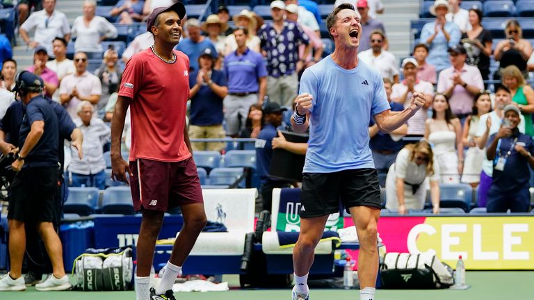 Joe Salisbury, of Great Britain, right, and Rajeev Ram, of the United States, react after defeating Rohan Bopanna, of India, and Matthew Ebden, of Australia, during the men's doubles final of the U.S. Open tennis championships, Friday, Sept. 8, 2023, in New York. (AP Photo/Frank Franklin II)
