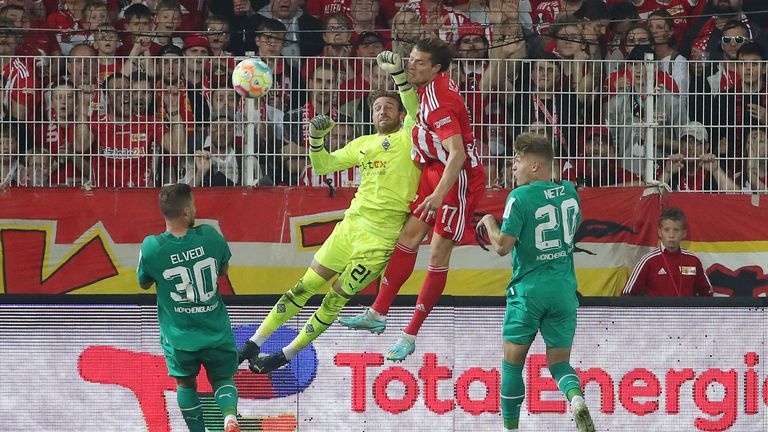 Moenchengladbach's Swiss defender Nico Elvedi (L), Moenchengladbach's German goalkeeper Tobias Sippel (2nd L)and Moenchengladbach's German defender Luca Netz (R) try to defend from Union Berlin's German forward Kevin Behrens (2nd R) scoring the 1:1 goal during the German first division Bundesliga football match Union Berlin v Borussia Moenchengladbach in Berlin, Germany on October 30, 2022