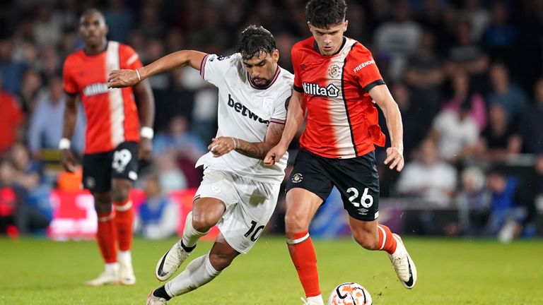 West Ham United's Lucas Paqueta and Luton Town's Ryan Giles battle for the ball