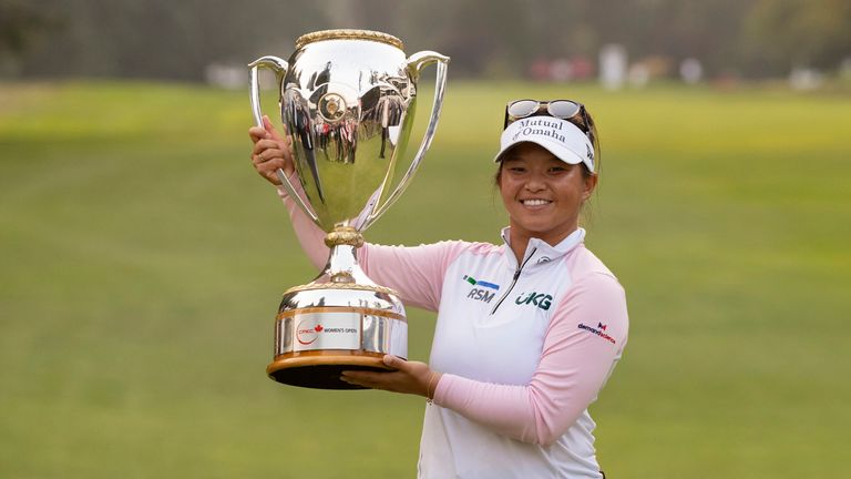 August 27, 2023, Vancouver, British Columbia, Canada: MEGAN KHANG of the United States poses with the trophy after winning the CPKC Women's Open on the first playoff hole at Shaughnessy Golf and Country Club.