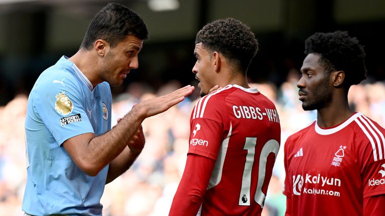 Morgan Gibbs-White holds his neck after clashing with Rodri