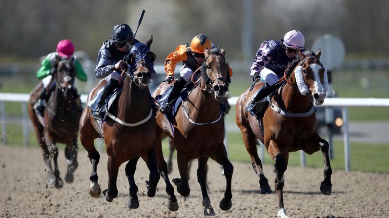 One Step Beyond ridden by Angus Villiers (left) goes on to win The Water Under The Bridge Handicap at Wolverhampton