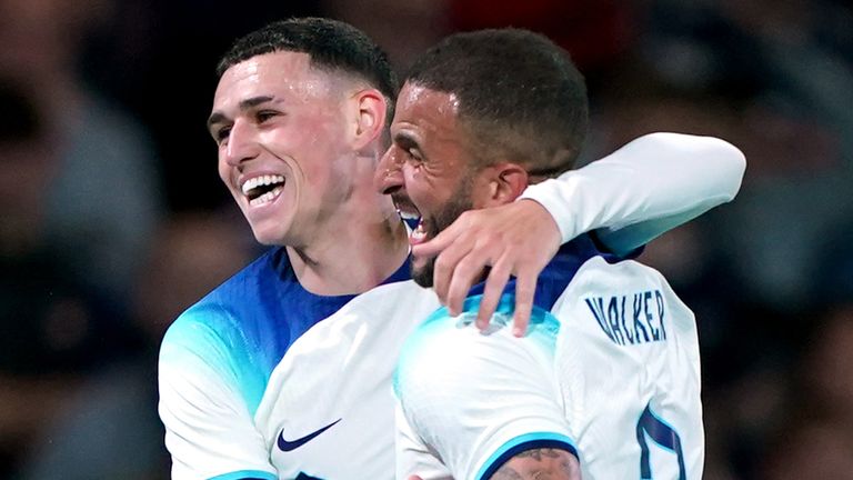 Phil Foden celebrates with Kyle Walker