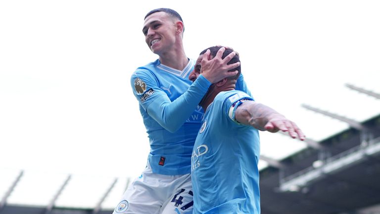 Phil Foden celebrates his goal with Kyle Walker