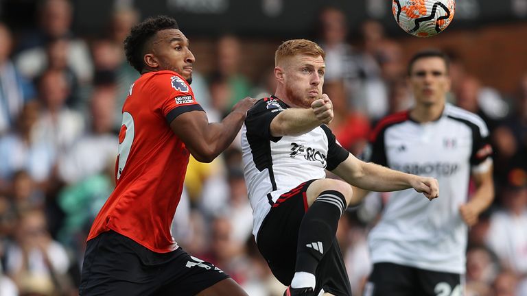 Jacob Brown challenges for the ball with Harrison Reed