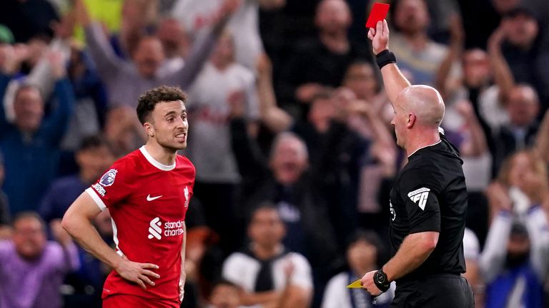 Diogo Jota is shown a red card after receiving a second booking for a foul Destiny Udogie 