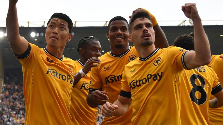 Hee-chan Hwang celebrates with his team-mates after giving Wolves the lead against Liverpool