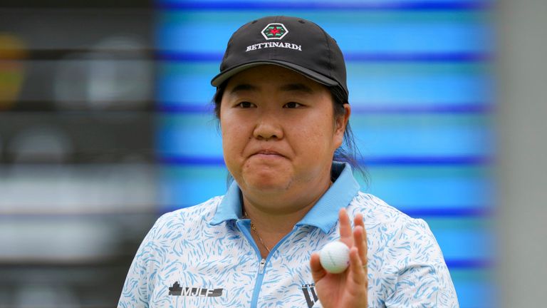 Ruixin Liu, of China, reacts to making a putt on the 18th green during the first round of the LPGA Tour Kroger Queen City Championship golf tournament in Cincinnati, Thursday, Sept. 7, 2023. (AP Photo/Aaron Doster)