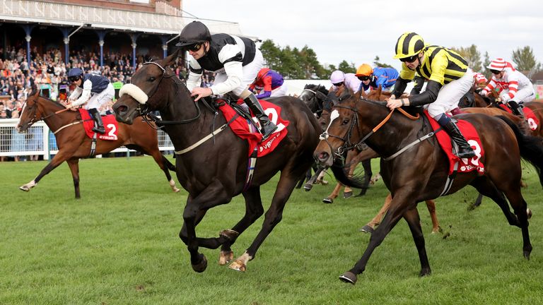 Joe Fanning and Significantly hit the front in the Ayr Gold Cup
