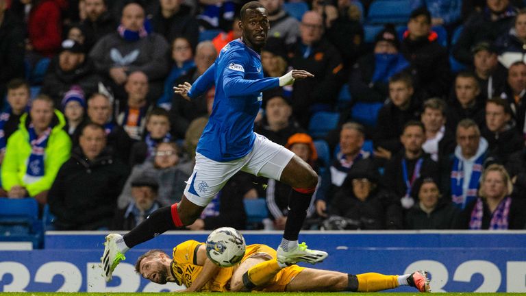 GLASGOW, SCOTLAND - SEPTEMBER 27: Rangers&#39; Abdallah Sima gets away from Livingston&#39;s Jamie Brandon after challenging him for the ball before scoring to make it 1-0 during a Viaplay Cup Quarter-final match between Rangers and Livingston at Ibrox, on September 27, 2023, in Glasgow, Scotland.  (Photo by Alan Harvey / SNS Group)