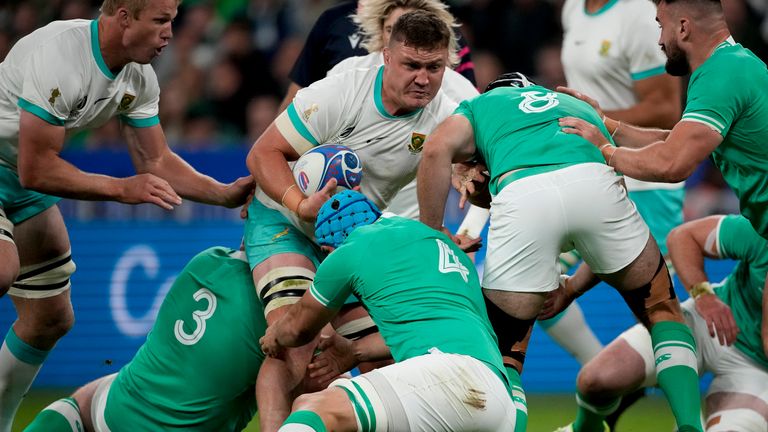 South Africa's Jasper Wiese, center above, is tackled by Ireland's Tadhg Beirne, center, Caelan Doris, right, Tadhg Furlong, left, during the Rugby World Cup Pool B match between South Africa and Ireland at the Stade de France in Saint-Denis, outside Paris, Saturday, Sept. 23, 2023. (AP Photo/Christophe Ena)