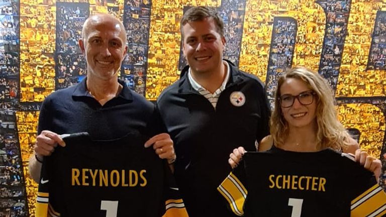 Sky Sports NFL's Neil Reynolds and Phoebe Schecter are presented with Steelers jerseys by Dan Rooney