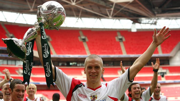 Steve Morison lifts the FA Trophy at Wembley with Stevenage