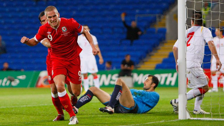 Steve Morison celebrates scoring for Wales against Montenegro in 2011. He made 20 appearances for his country