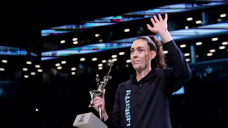 New York Liberty forward Breanna Stewart waves to fans while holding the MVP trophy before Game 2 of a WNBA basketball playoffs semifinal between the Liberty and the Connecticut Sun, Tuesday, Sept. 26, 2023, in New York.