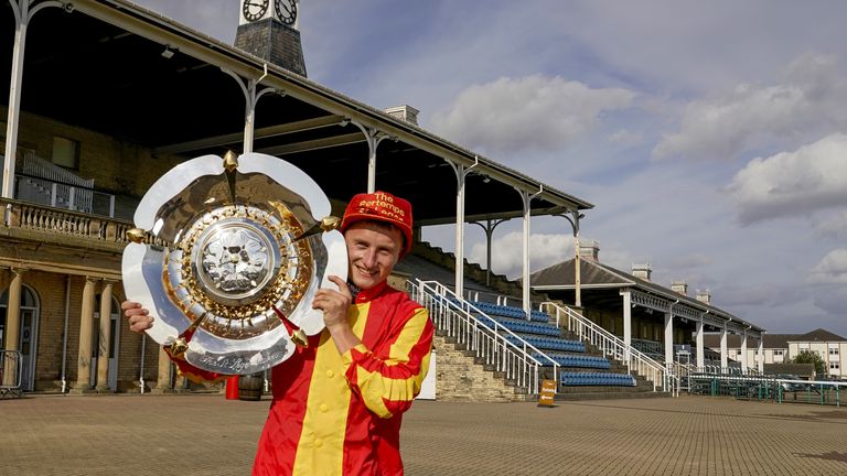 Marquand poses with the St Leger Trophy in Doncaster