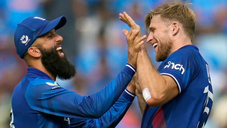 England&#39;s David Willey, right, celebrates with England&#39;s Moeen Ali the wicket of India&#39;s Virat Kohli during the ICC Men&#39;s Cricket World Cup match between England and India in Lucknow, India, Sunday, Oct. 29, 2023. (AP Photo/Aijaz Rahi)