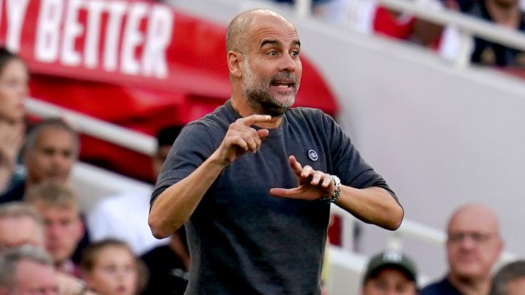 Pep Guardiola gives his team instructions from the touchline at the Emirates Stadium