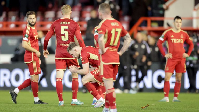 Aberdeen players react following their late defeat to PAOK