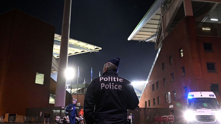 A police officer stands guard outside the King Baudouin Stadium 