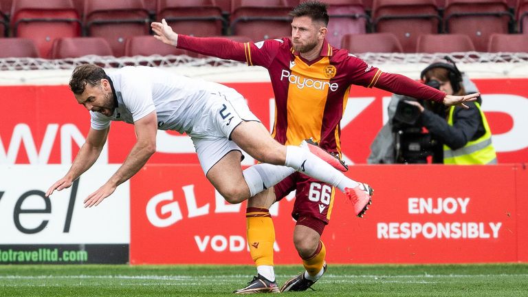 MOTHERWELL, SCOTLAND - MAY 20: Motherwell&#39;s Calum Butcher tackles County&#39;s Connor Randall which was initially awarded as a penalty before referee Alan Muir overturns after a VAR check during a cinch Premiership match between Motherwell and Ross County at Fir Park, on May 20, 2023, in Motherwell, Scotland.  (Photo by Craig Foy / SNS Group)