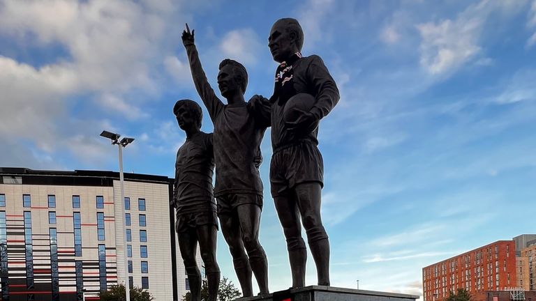 A statue of Charlton as part of the 'United Trinity'