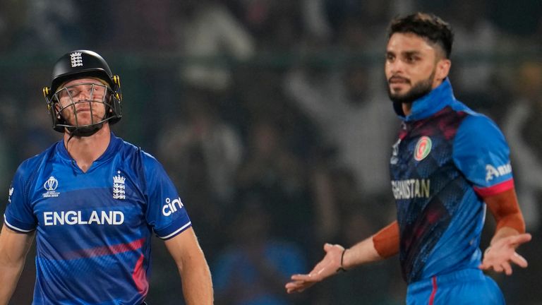 Afghanistan's Naveen-ul-Haq celebrates after dismissing England's captain Jos Buttler