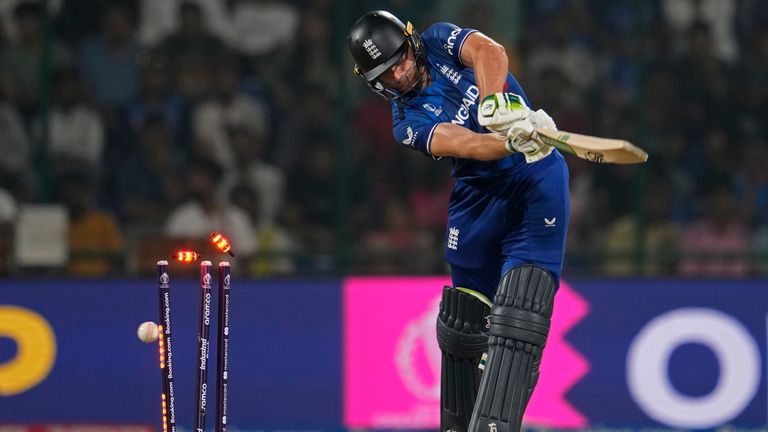 England&#39;s captain Jos Butler is bowled by Afghanistan&#39;s star spinner Naveen-ul-Haq