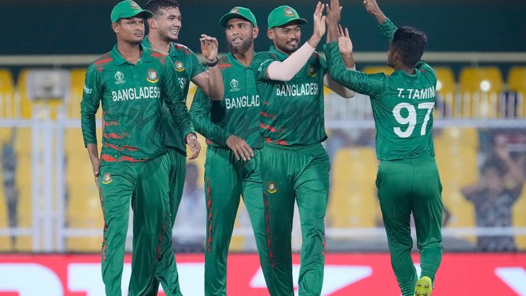 Bangladesh players celebrate the wicket of England's Liam Livingstone during the ICC Cricket World Cup warm up match between Bangladesh and England in Guwahati