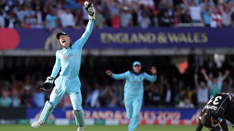 England's Jos Buttler celebrates after running out New Zealand's Martin Guptill during the Super Over in the Cricket World Cup finalin 2019