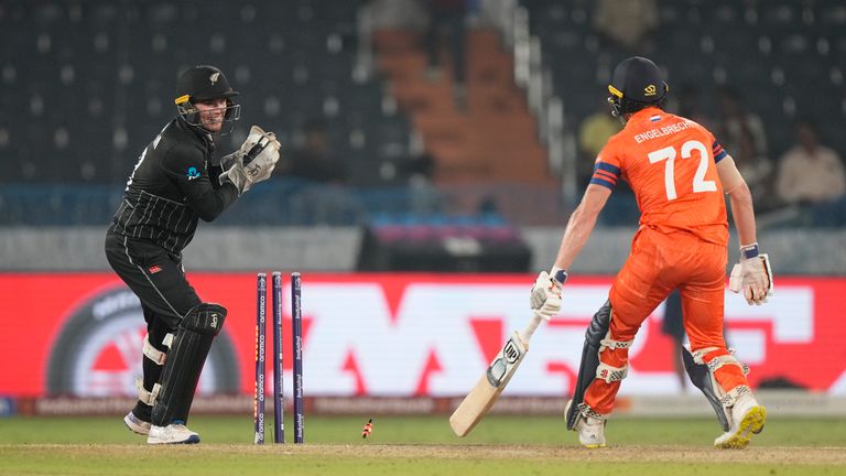 New Zealand's wicketkeeper Tom Latham dislodges the bails to stump out Netherlands' Sybrand Engelbrecht, which was deemed not out by the third umpire