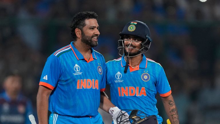 India's captain Rohit Sharma celebrates his century with teammate Ishan Kishan