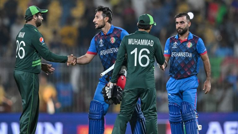 Afghanistan players shake hands after recording a historic win against Pakistan