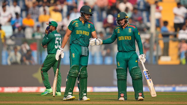 South Africa's Aiden Markram and Quinton De Kock celebrate their milestones against Bangladesh