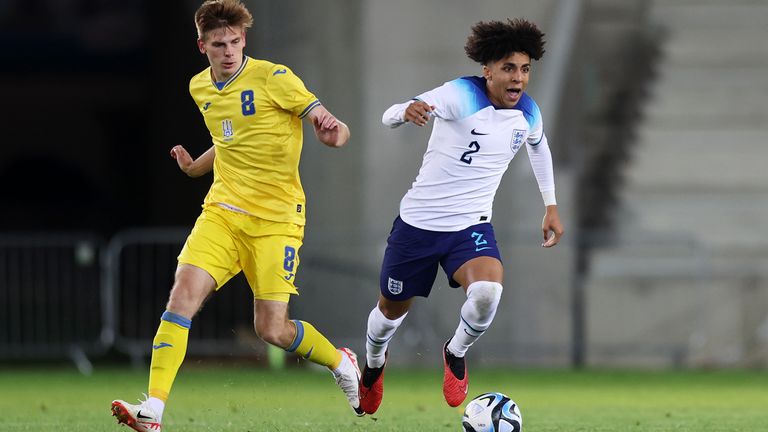 Manchester City&#39;s Rico Lewis runs with the ball for England from Ukraine&#39;s Oleh Ocheretko