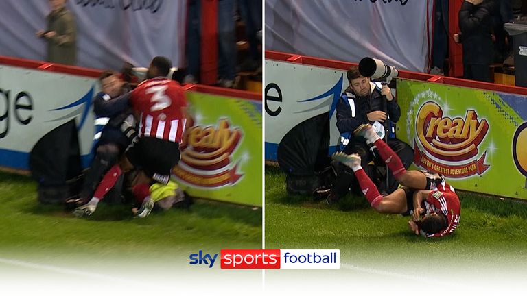 Exeter player, Zak Jules suffers a nasty collision with a pitchside photographer during their Carabao Cup fourth round tie against Middlesbrough.