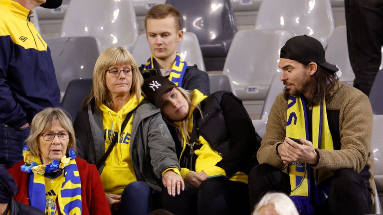 Swedish fans at the King Baudouin Stadium react after Sweden's Euro 2024 Qualifier against Belgium is abandoned following a shooting in Brussels