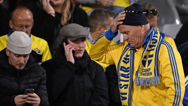 Swedish fans at the King Baudouin Stadium react after Sweden's Euro 2024 Qualifier against Belgium is abandoned following a shooting in Brussels