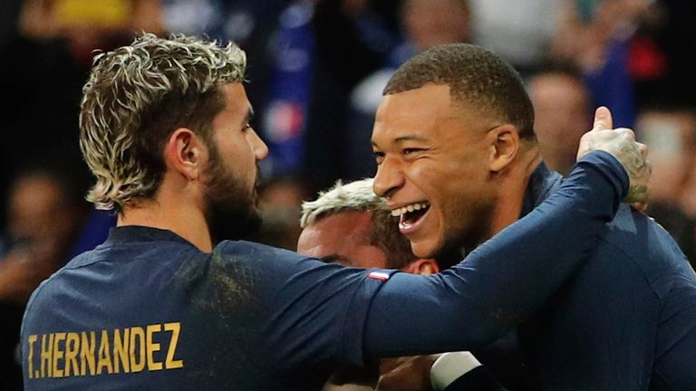 France's Kylian Mbappe, right, celebrates with teammates after he scored his side's third goal during the friendly soccer match between France and Scotland at the Pierre Mauroy stadium, in Villeneuve-d'Ascq, northern France, Tuesday, Oct 17, 2023. (AP Photo/Michel Spingler)